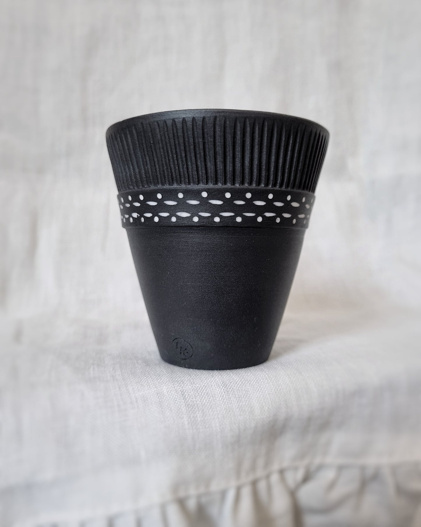 Verre porcelaine noire motifs blancs