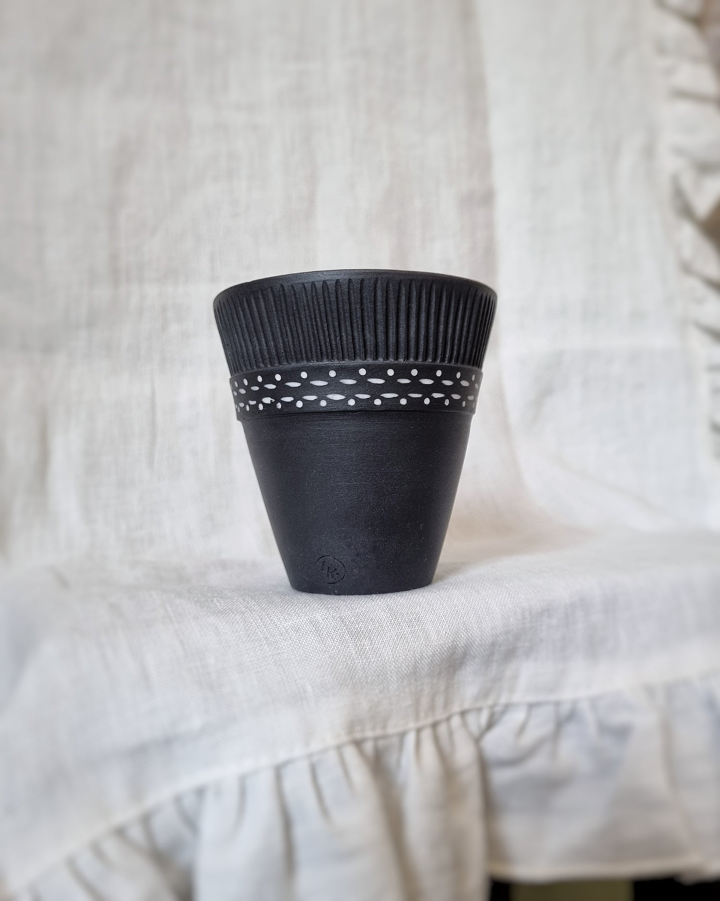 Verre porcelaine noire motifs blancs